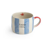Blue and white striped stoneware mug with 'Daddy Cool' text and red star on the inside.