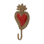 An ornate antique-style Sacred Heart shaped wall hook with a red enamel heart centre and a decorative gold-toned metal frame and hook, shown on a plain white background.