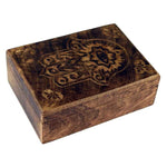 A wooden trinket box with carved Hand of Hamsa detail on the lid