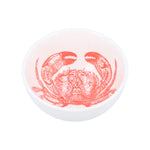 Small white ceramic bowl with red crab design inside