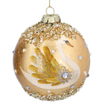 A decorative glass Christmas ornament shaped like a swan, featuring a gold glittery background, a white swan illustration with gold feathers, and embellishments with white faux pearls and clear rhinestones, hanging from a gold string.