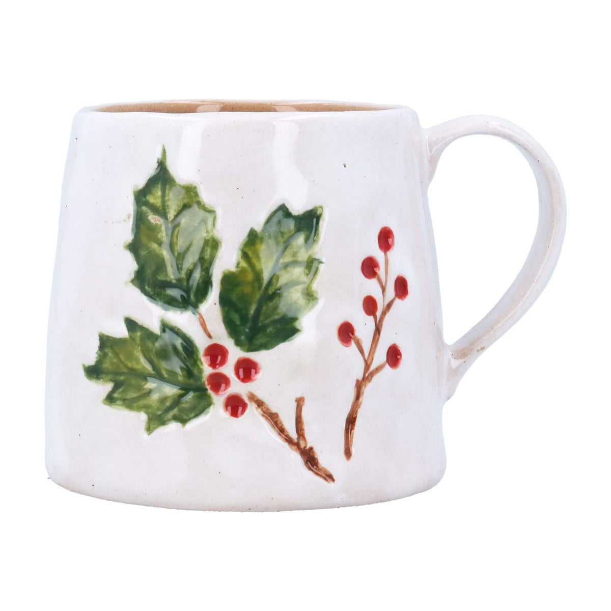 A white stoneware mug decorated with a hand-painted green holly leaf branch and red berries.