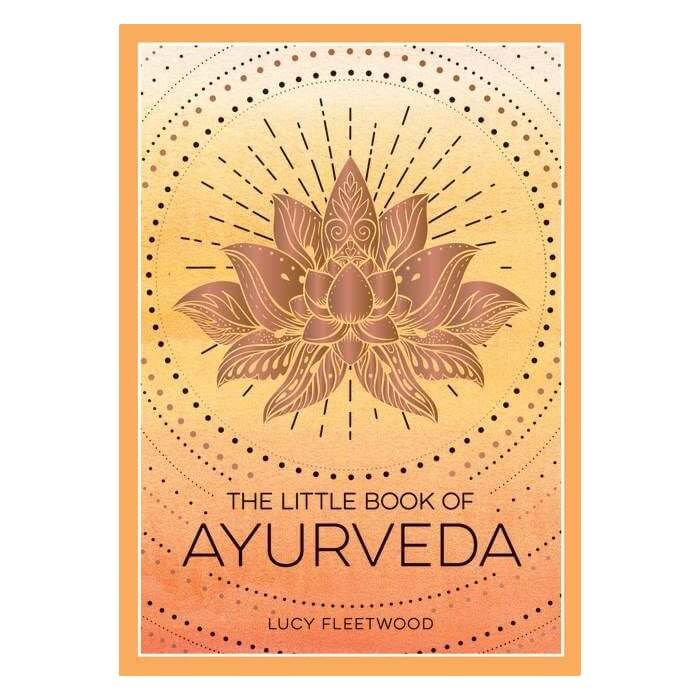 Book cover of 'The Little Book of Ayurveda' with a lotus flower design on an orange and yellow gradient background.