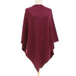 Mahogany red poncho on a mannequin against a white background