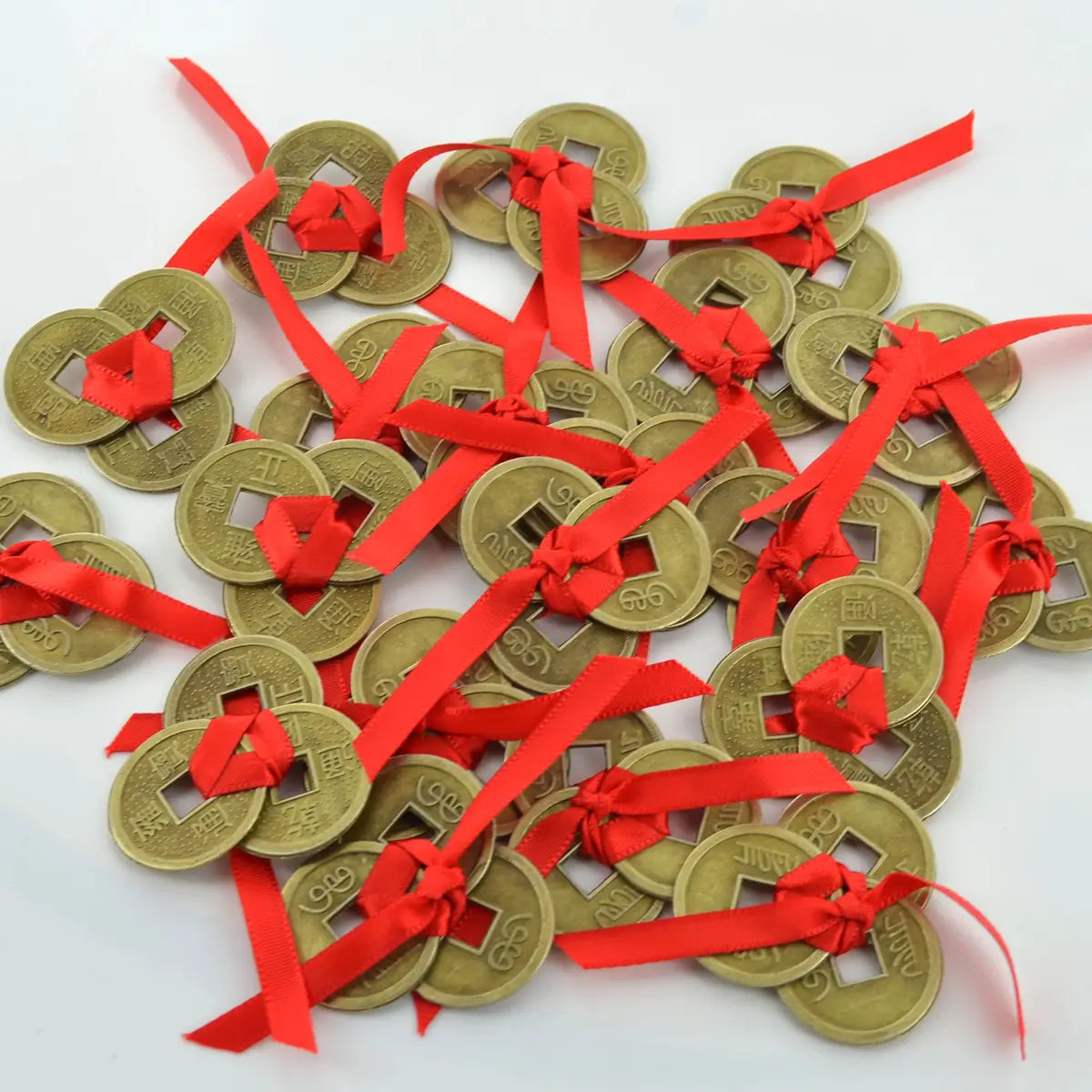 Three Lucky Feng Shui Cash Coins Tied With Red Ribbon