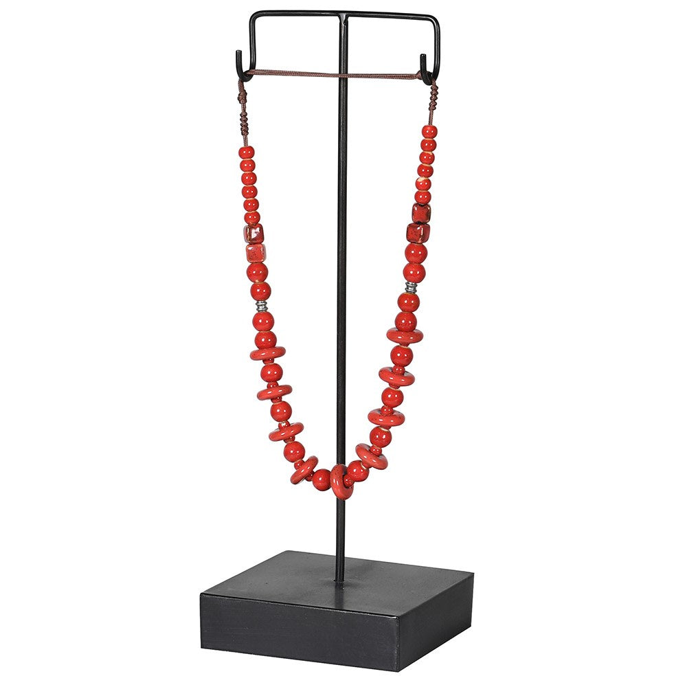 Red Necklace On Metal Stand